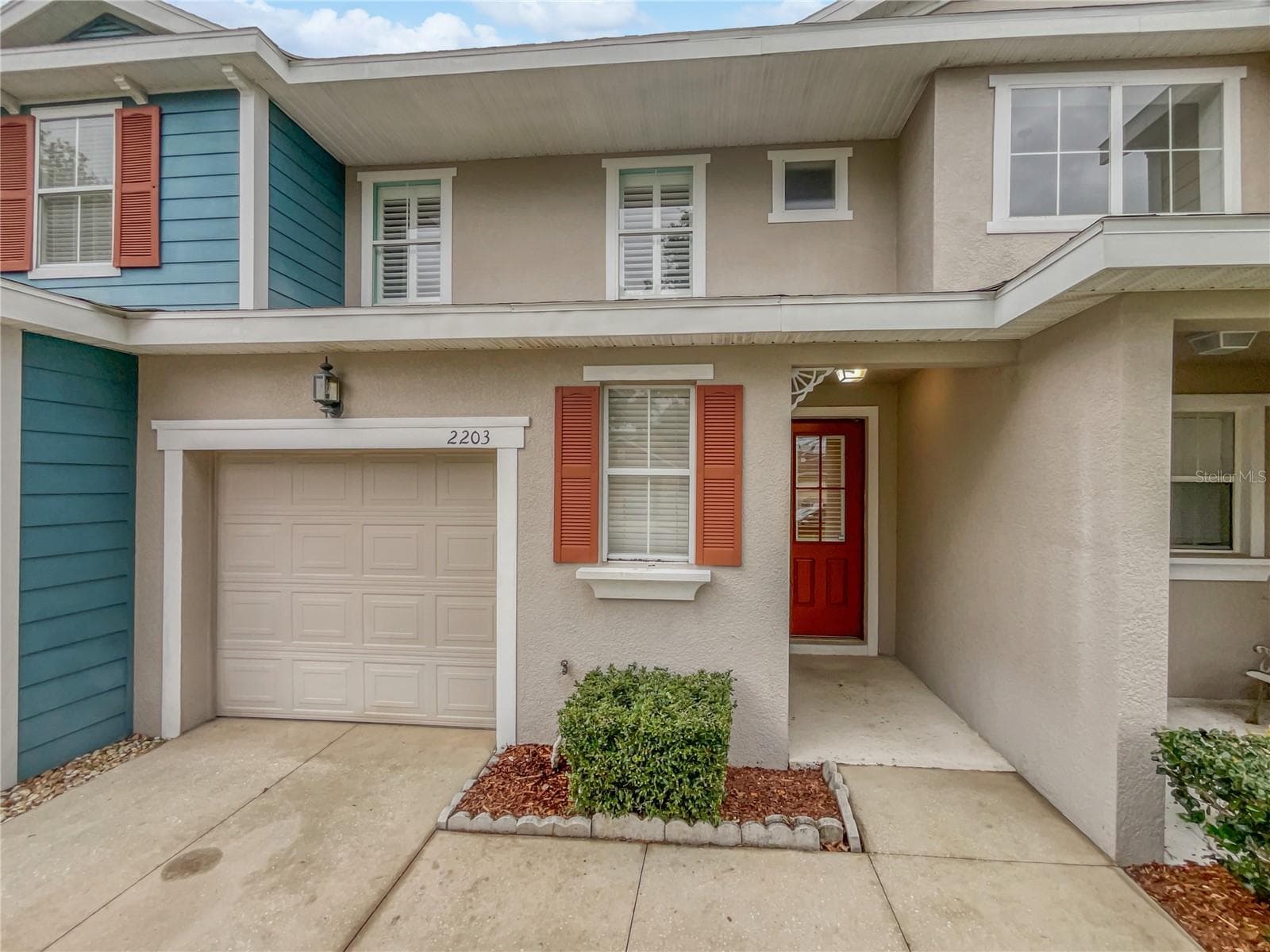Front exterior view of a two-story townhouse in Mount Dora, Florida