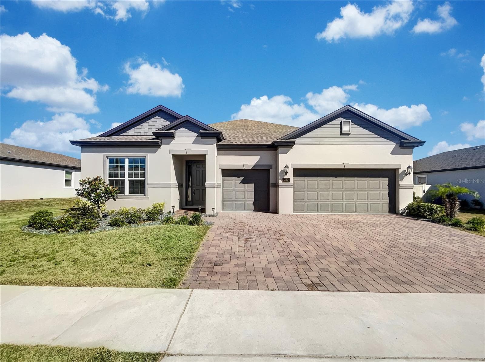 Front exterior of a two-story single-family home in Venezia South, Howey in the Hills, Florida.