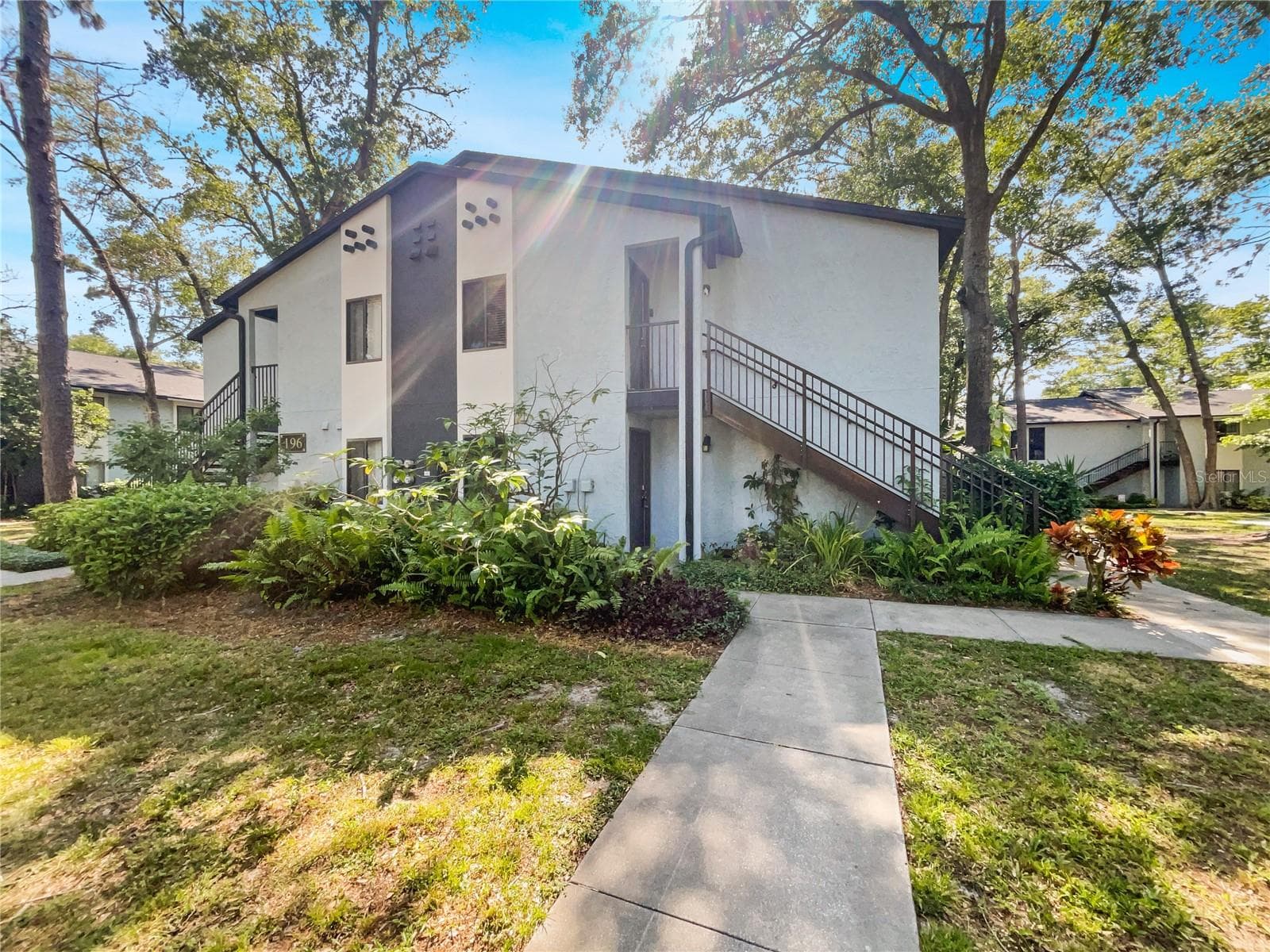 Ground-floor condominium exterior at Reserve at Wekiva Bend, Altamonte Springs, FL