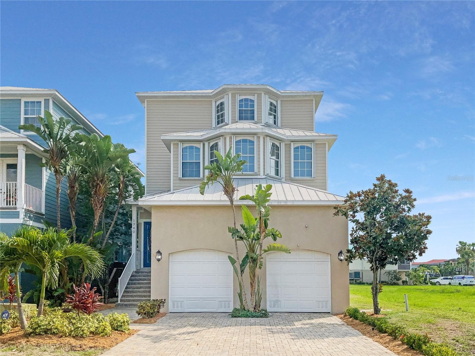 Front exterior view of a two-story single-family home in Apollo Beach, Florida.