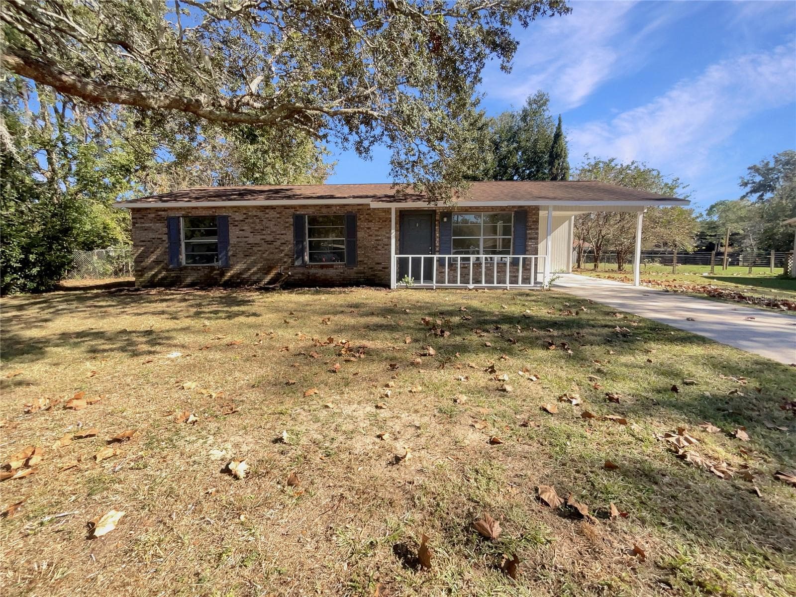 Front exterior of a freshly painted single family home on a quarter-acre lot in Belleview Hills