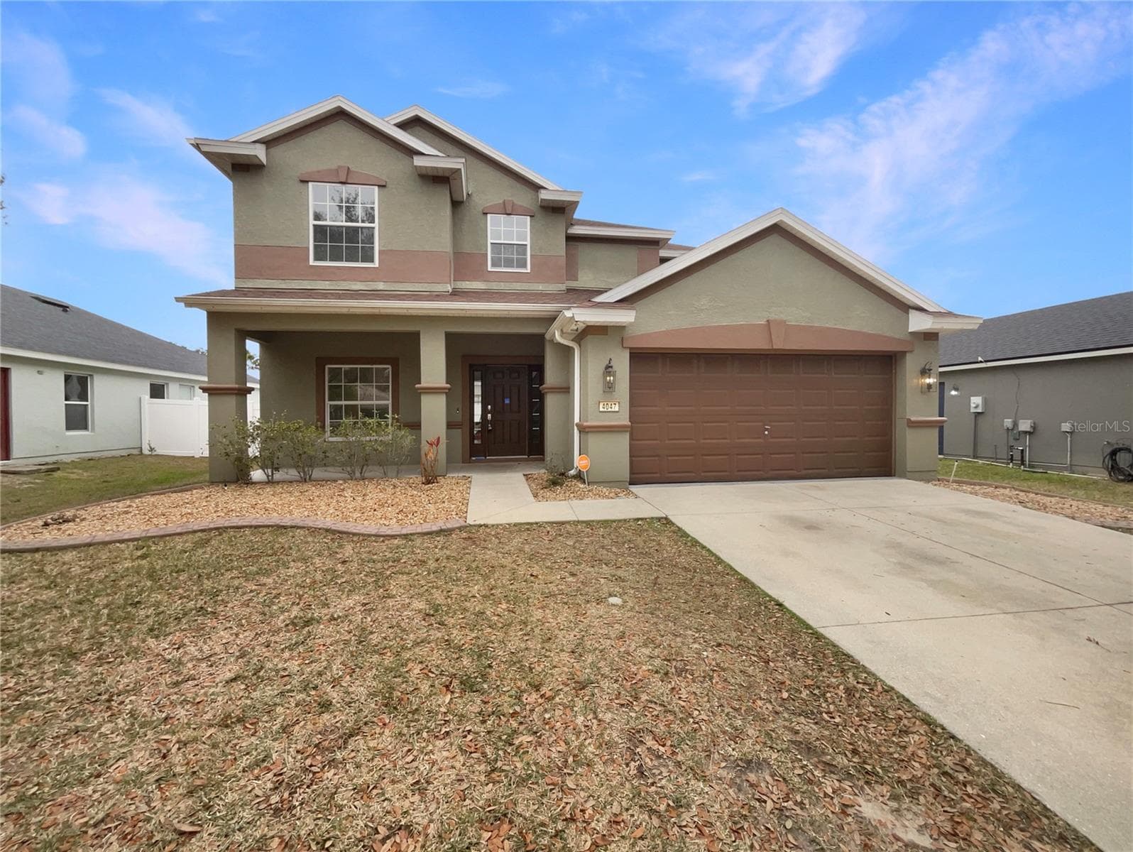 Front exterior view of a two-story single-family home in Ocala Florida