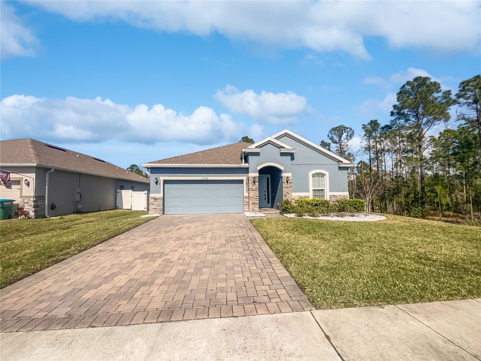 Front exterior of a two-story single-family home in Deltona, Florida built in 2021.