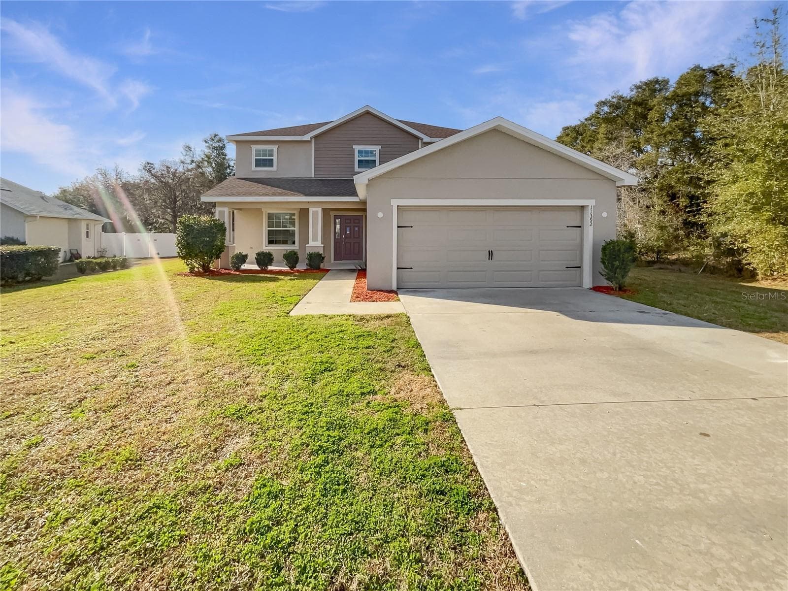 Front exterior of a two-story single-family home built in 2020 in Ocala, Florida.